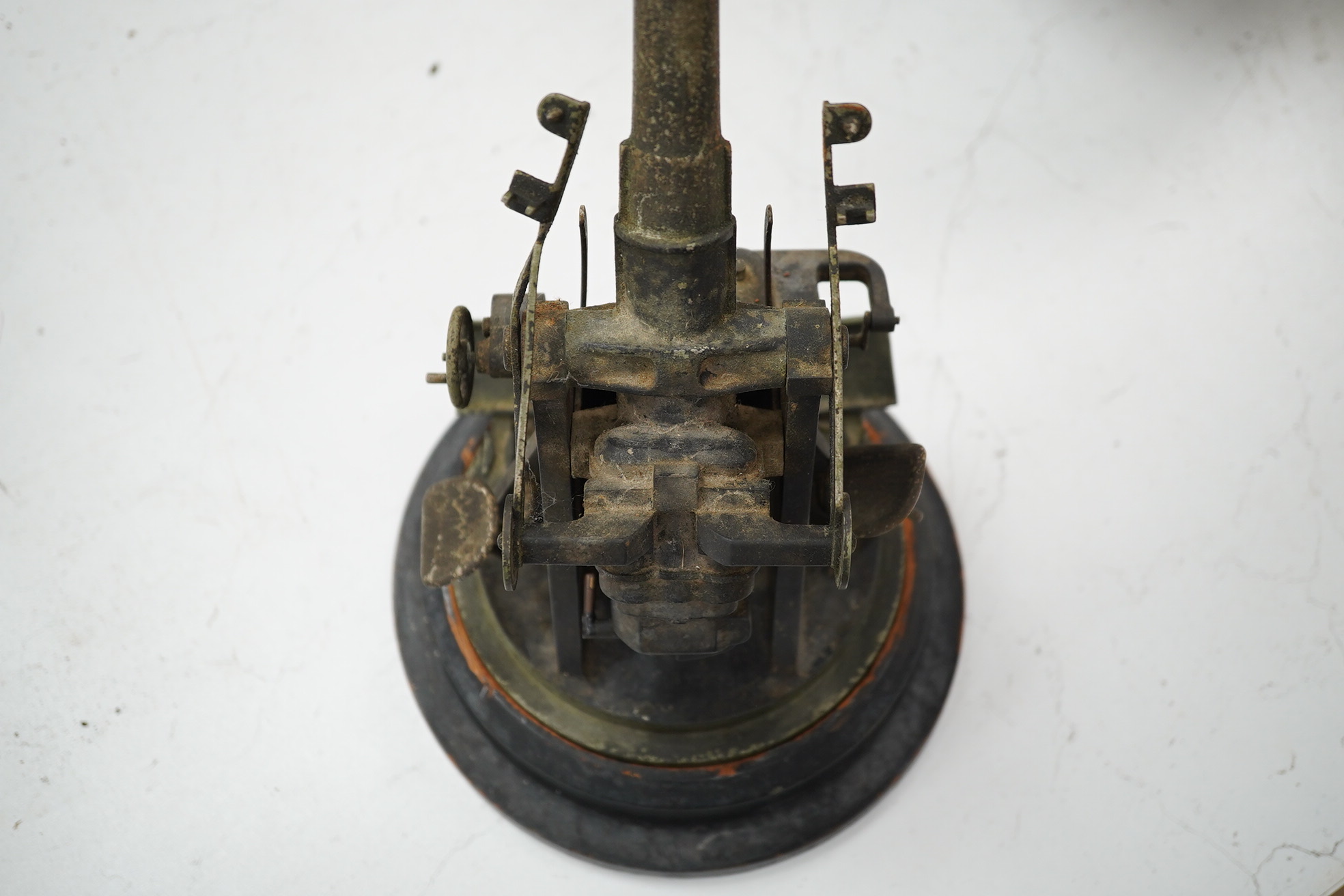 A steel model of a First World War 4 inch mark IX E.O.C. anti-aircraft gun, barrel 18cm, on a turned ebonised pine base with applied label. Condition - fair, some wear overall